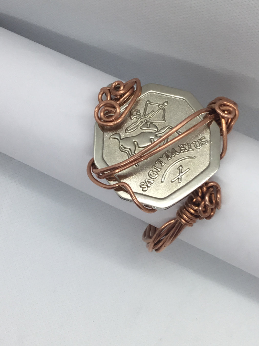 The zodiac sign wrapped in copper bracelet